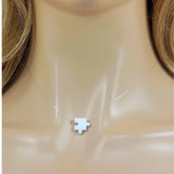 White puzzle piece pendant on a clear necklace. Lab Created Opal Puzzle Pendant Floating Illusion Necklace.